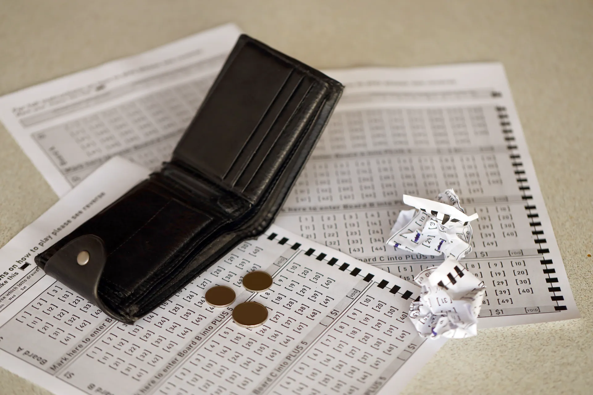 a person filling out multiple lottery tickets to win lottery jackpots